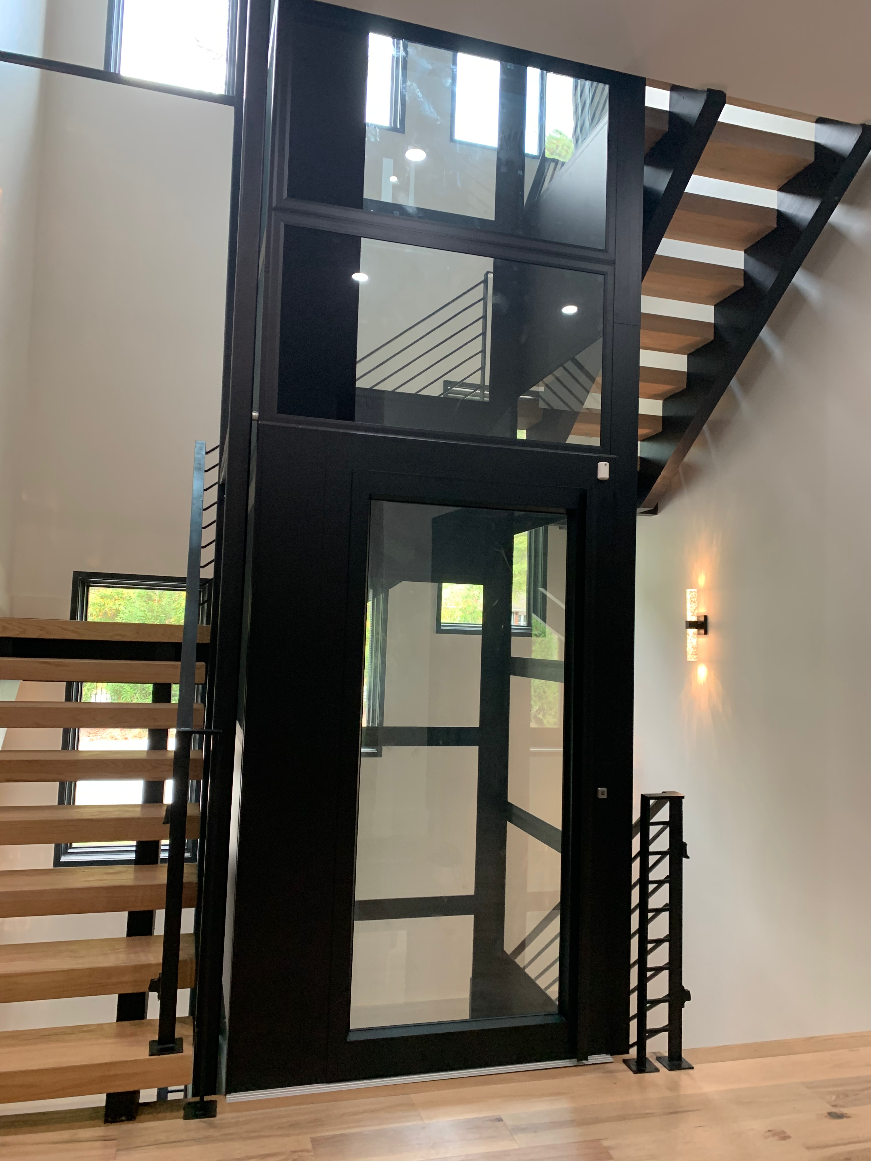 Glass elevator and floating stairs